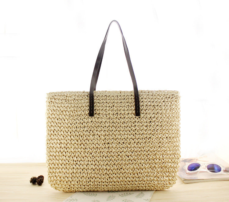 Bolso bandolera de playa redondo de paja tejida