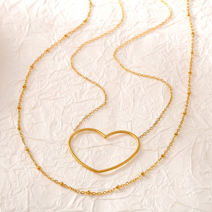 Collar de acero inoxidable chapado en oro de 18 quilates con cadena de clavícula doble con diseño de amor hueco europeo y americano