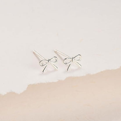 Damen-Ohrstecker mit Schleife und Kreuz, goldfarben