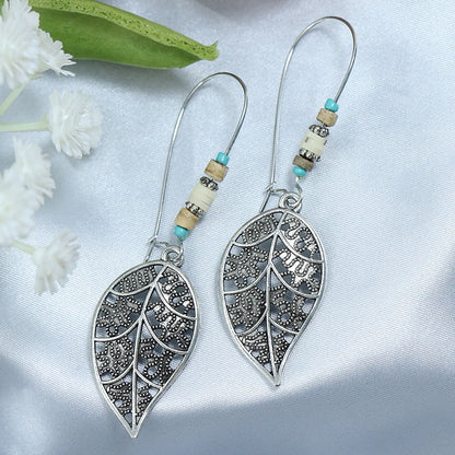 Pendientes de borlas con incrustaciones de turquesa y metal geométrico de estilo étnico