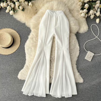 Pantalones acampanados de malla con costuras irregulares para mujer