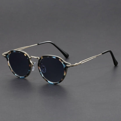 Gafas de sol con montura circular de metal y protección UV para hombres y mujeres.
