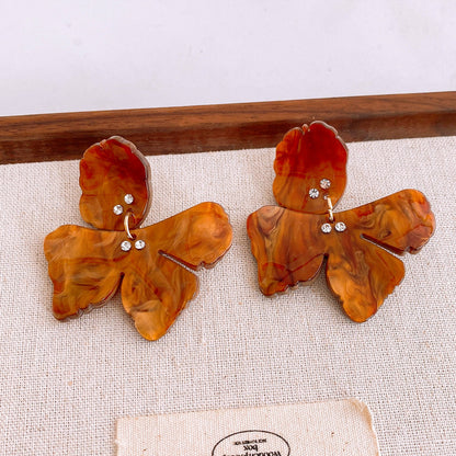 Pendientes de flor de diamante de resina con aguja de plata