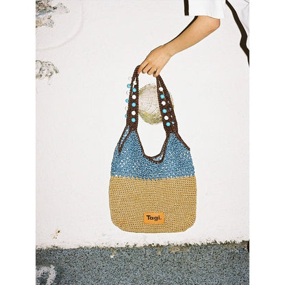Bolso de viaje hecho a mano con cuentas de madera y cuerda
