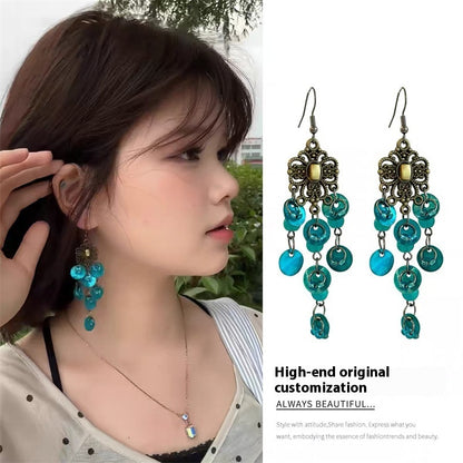 Pendientes redondos con borlas de concha y diseño de flores, ligeros, de lujo y de gran sentido.
