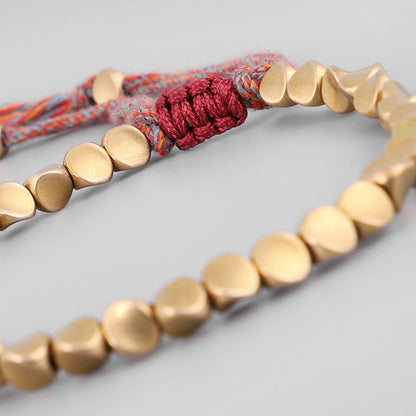 Handgemachte tibetisch-buddhistische geflochtene Baumwoll-Kupferperlen Glücksseil-Armbänder und Armreifen für Frauen und Männer