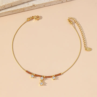Tobillera pequeña de acero y titanio con circonitas para mujer