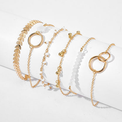 Tocona - Pulseras bohemias con borlas doradas para mujer, joyería bohemia, cuentas geométricas de hojas, conjunto de pulseras con dijes en capas 