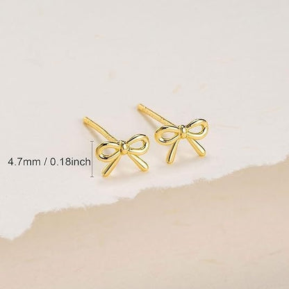 Damen-Ohrstecker mit Schleife und Kreuz, goldfarben