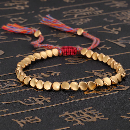 Handgemachte tibetisch-buddhistische geflochtene Baumwoll-Kupferperlen Glücksseil-Armbänder und Armreifen für Frauen und Männer