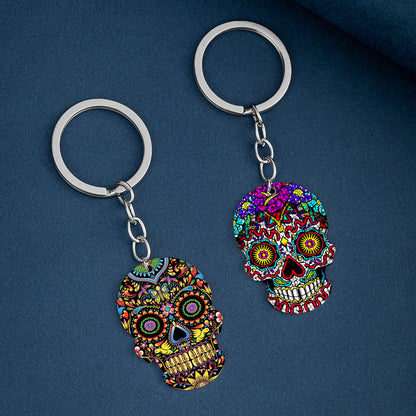 Llavero de acero inoxidable con estampado a color de calavera del Día de los Muertos