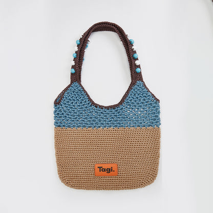 Bolso de viaje hecho a mano con cuentas de madera y cuerda