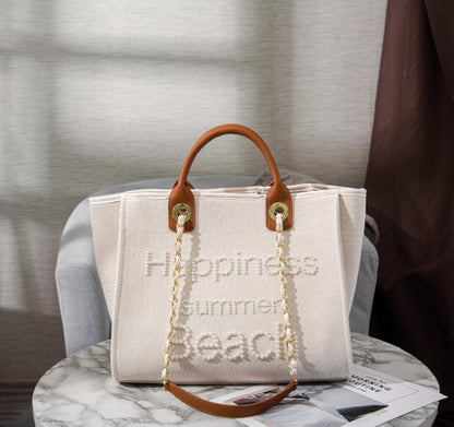Bolso de lona con cuentas en color blanco roto