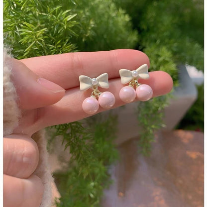 Pendientes de lazo con perla y corazón para mujer