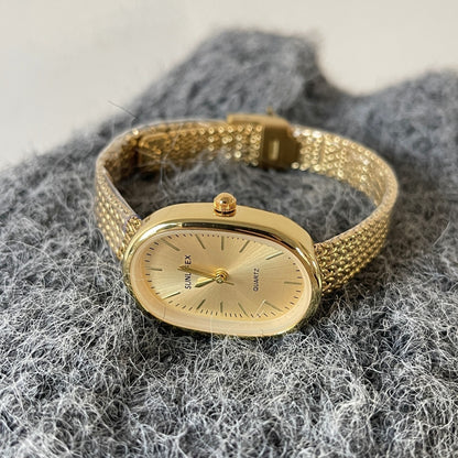 Reloj de mujer exquisito con correa de acero dorado de alta calidad