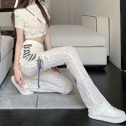 Pantalones acampanados con cordones laterales para mujer