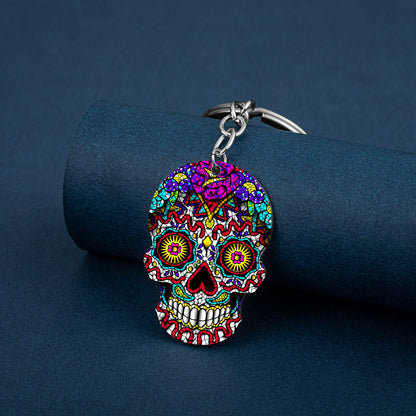 Llavero de acero inoxidable con estampado a color de calavera del Día de los Muertos