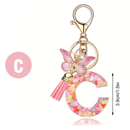 Llavero con borla de mariposa, lentejuelas y corazón con letras de amor