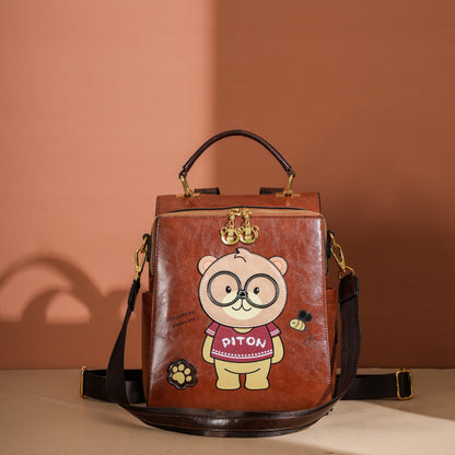 Mochila bandolera portátil con diseño de oso de dibujos animados