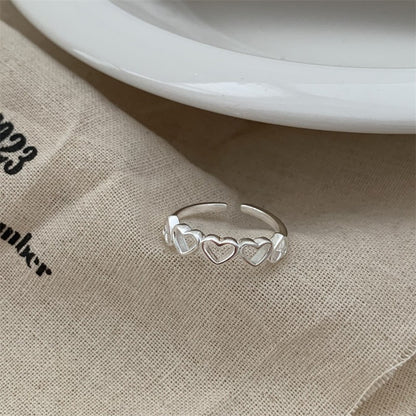 Anillo ajustable con forma de corazón para mujer