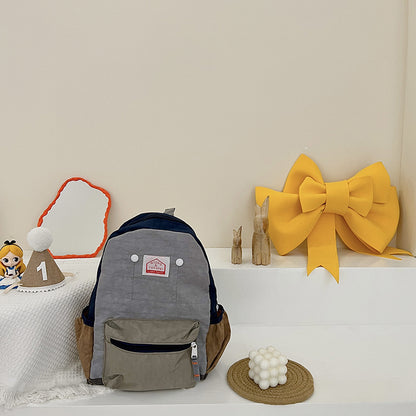 Mochila de lona ligera y sencilla para niños y niñas con protección para la columna vertebral.